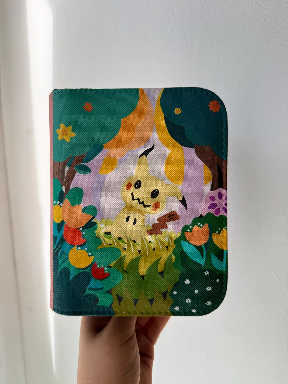 Custom handpainted Pokémon Mimikyu toploader binder